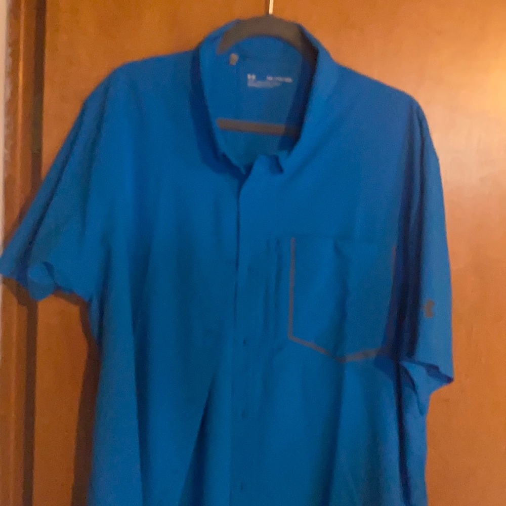 Under Armour short sleeve golf shirt.
